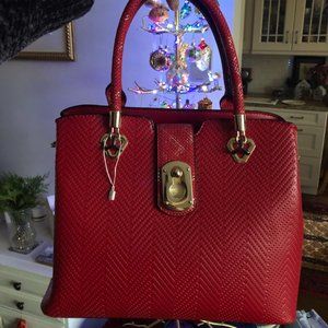 Red Handbag Faux leather tote with gold buckle